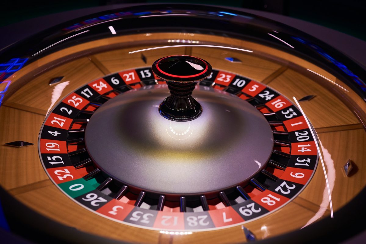 Roulette wheel In Casino Wide Shot On A Black Background